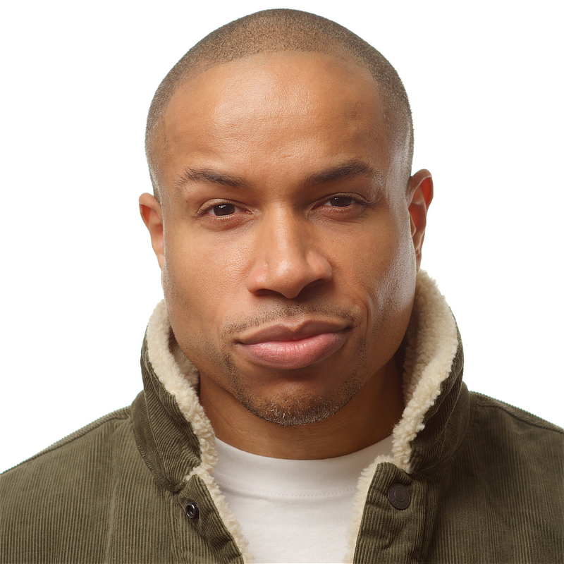 Akin Ajamu - Headshot - Green Jacket 01