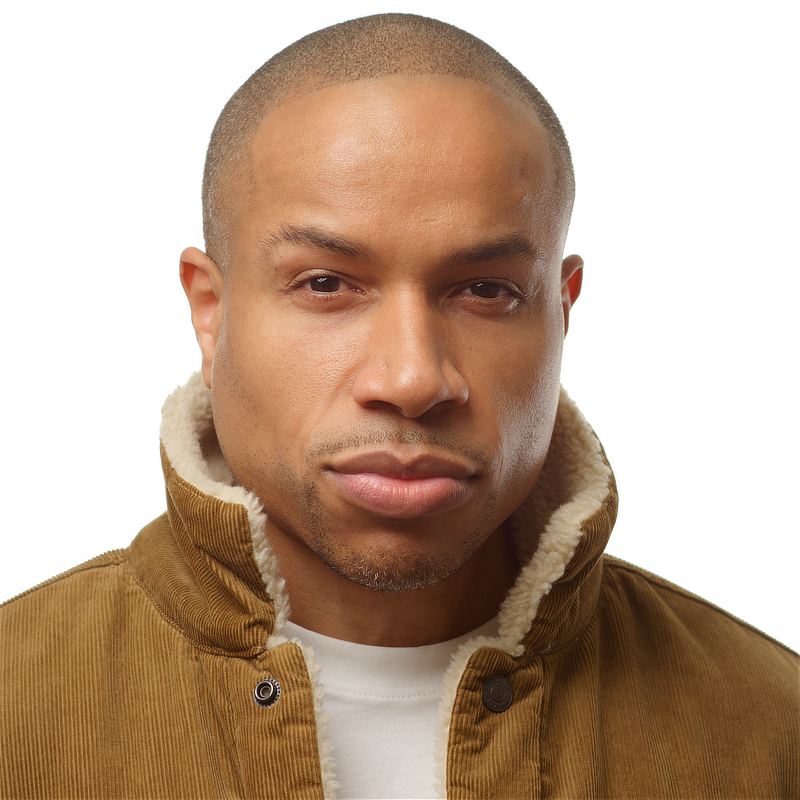 Akin Ajamu - Headshot - Orange Jacket 01